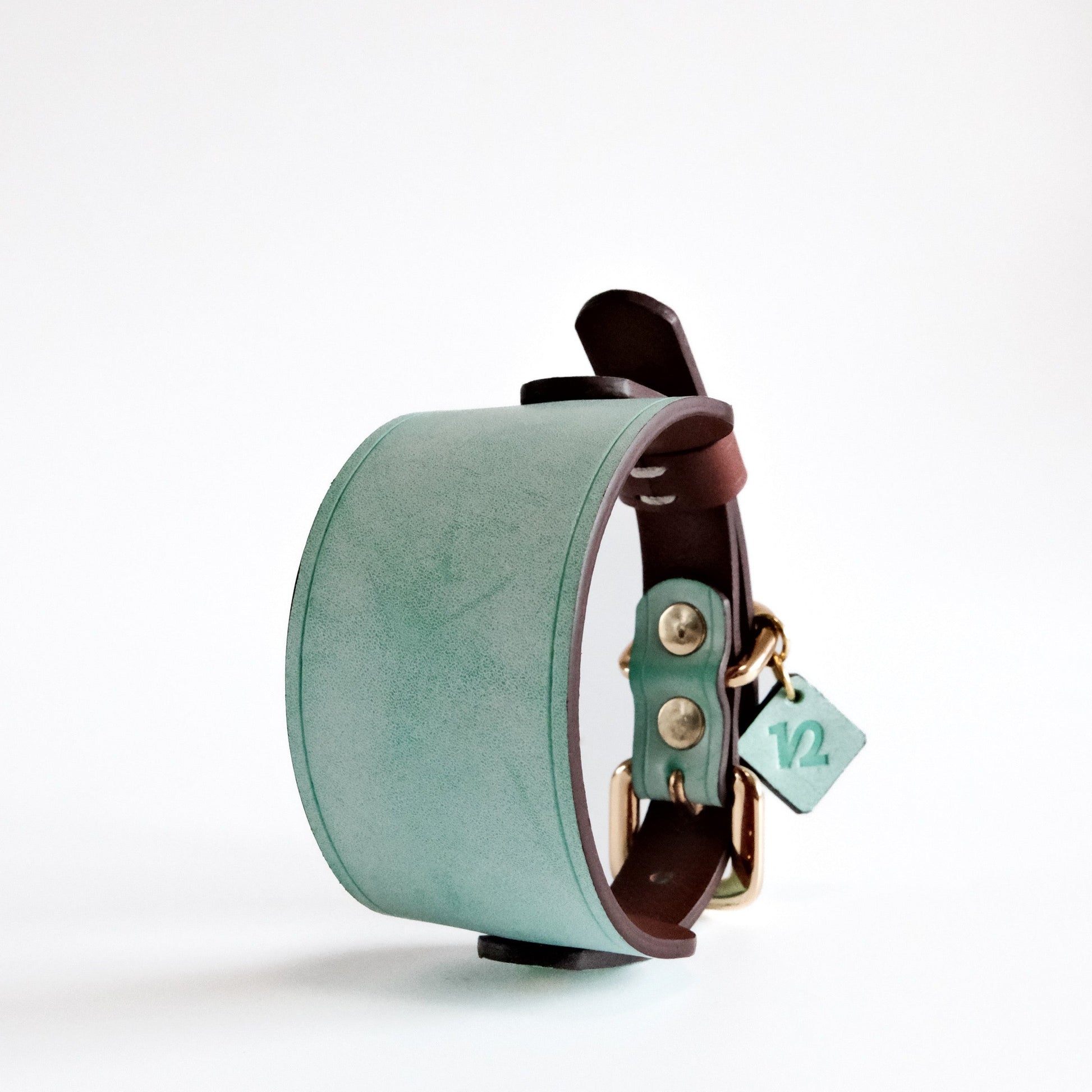 Mint green and smoky brown leather collar with bow design, featuring Italian handmade craftsmanship. Ideal as a personalized dog collar, designer dog collars, puppy collars, cool dog collars, and cute dog collars for small and large pets.