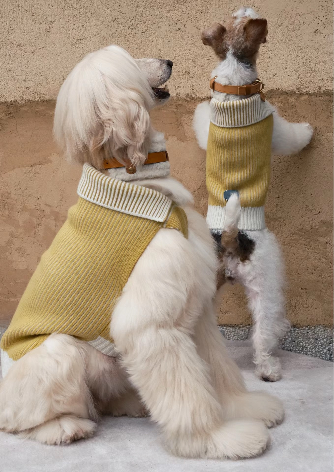 Stack of handmade Merino wool leather dog collars, featuring cozy and stylish designs in neutral and pastel tones.